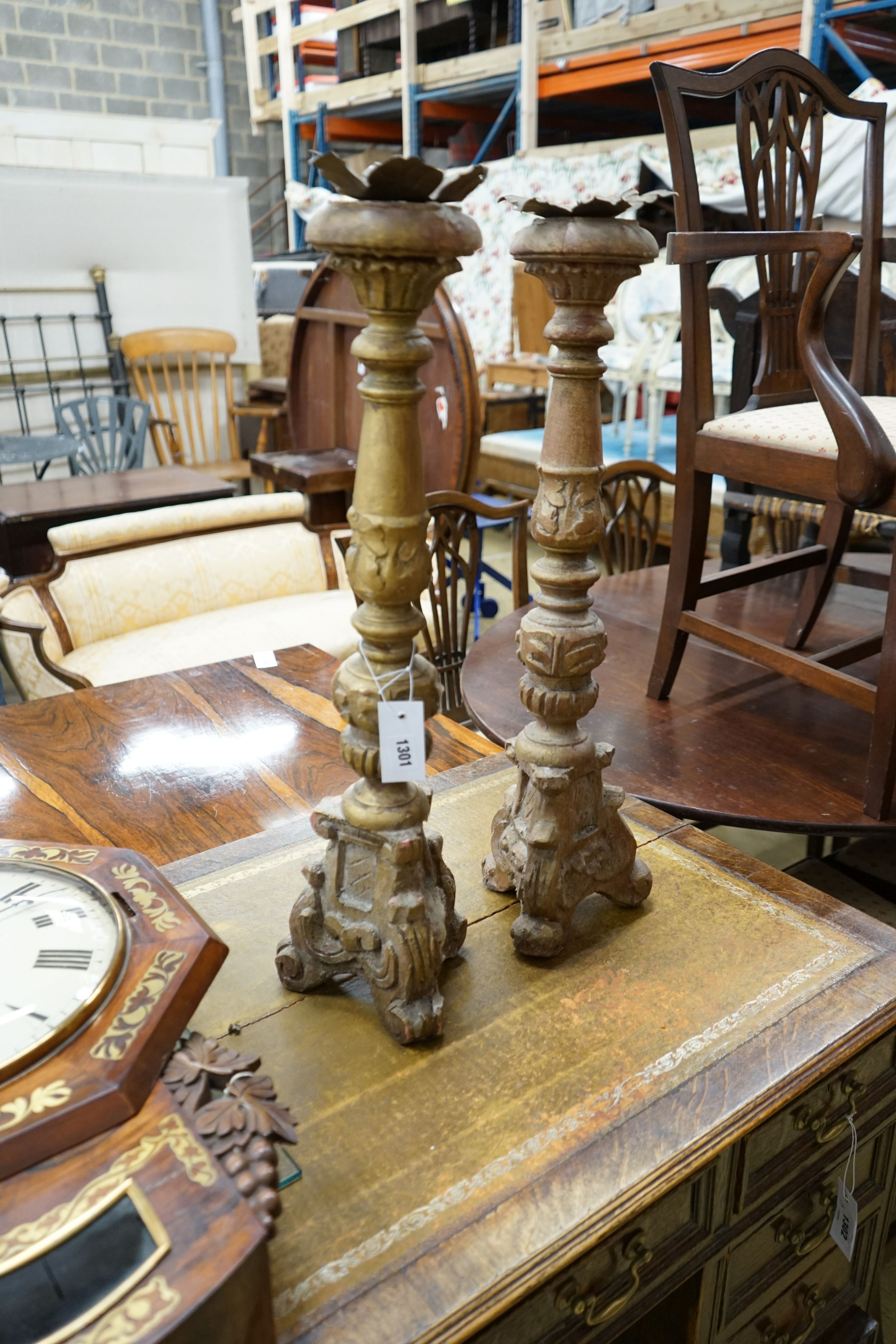 A pair of 18th century style carved giltwood pricket candlesticks, height 70cm